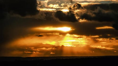 Dramatic Sunset in the Sky Through Orange Layered Cumulus Clouds Timelapse