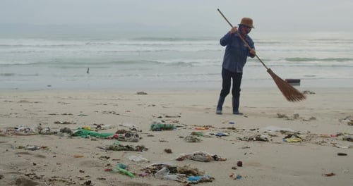 Volunteer Woman Cleaning Up Beach