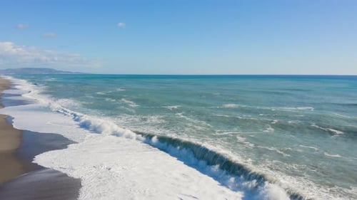 Rough ocean waves on beach coast