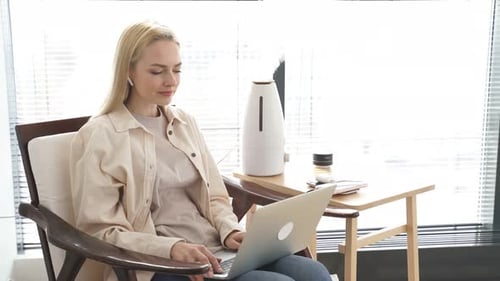Woman Working From Home on Laptop