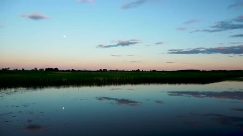 Panorama of the Lake at Sunset. The Lake Reflects the Sky