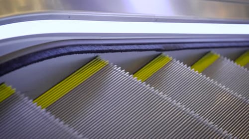An Escalator in a Mall. A Convenient Device for Transporting People.