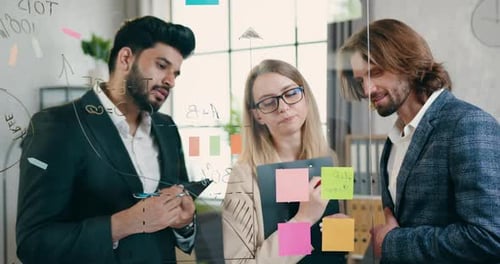 Team Collaborates, Brainstorms at Modern Workplace