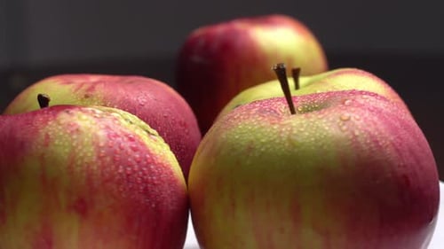 Wet Apples Rotating in Close-Up Shot