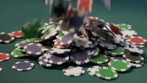 Jackpot. Casino chips forming a big pile on a green gaming poker table. 4k