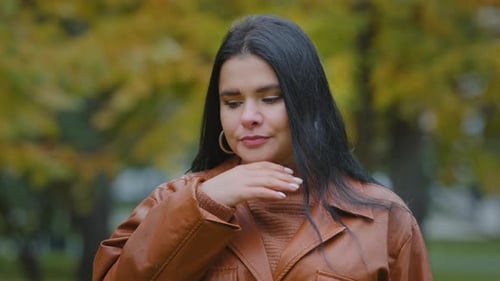 Unhealthy Young Hispanic Woman Standing Outdoors Coughing Suffering From Seasonal Flu or Chronic