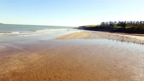 Woman horse riding on seashore