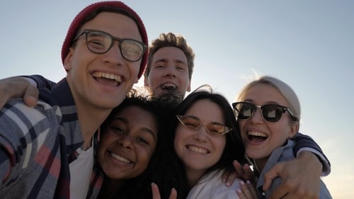 Smiling Young Adults Taking Selfie Together
