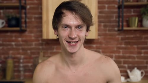 Man Eating Salad in Kitchen