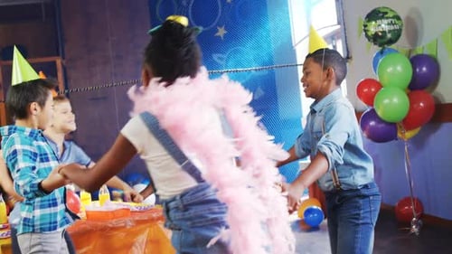 Children Play Ring Around the Rosie at Birthday Party