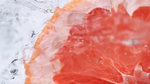 Grapefruit Half Splashing in Water, Macro View