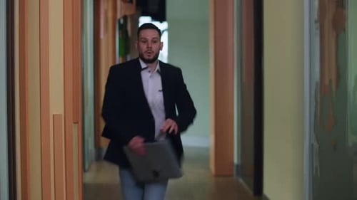 Wide Shot Office Corridor with Hurrying Man Running Passing Leaving