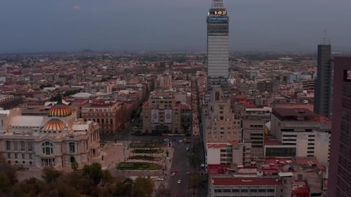 Drone Camera Slowly Moving Forward to Torre Latinoamericana Tall Building Around Palacio De Bellas