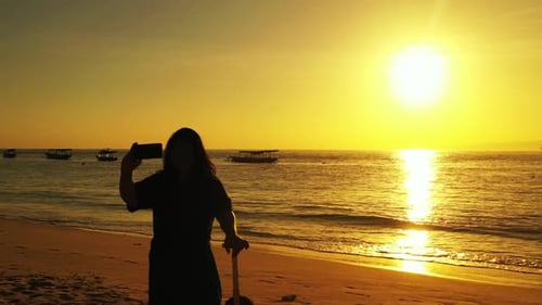 Female model tans on tropical shore beach voyage by blue sea and white sandy background of the Maldi