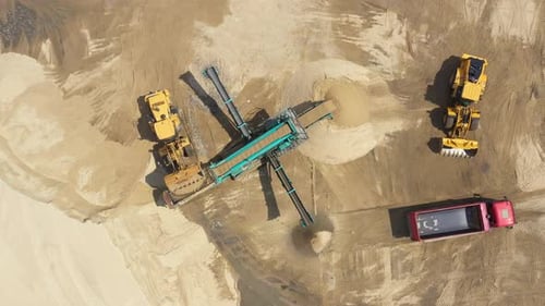 Aerial view loading bulldozer in open air quarry. Sand mining industry. Bulldozer machine. Crawler b