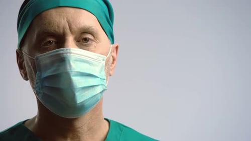 Doctor in Scrubs and Surgical Mask Close Up