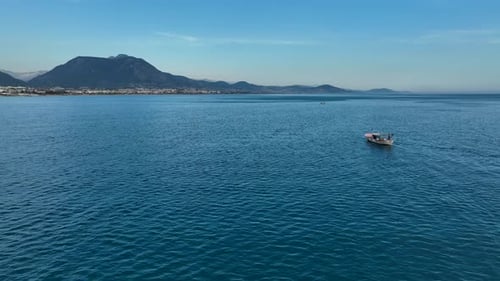 Sunrise Fishing boat goeas to sea aerial view Turkey Alanya 4 K