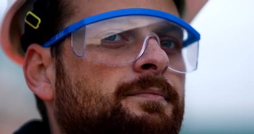 Man Wearing Hard Hat and Protective Eyewear Close Up