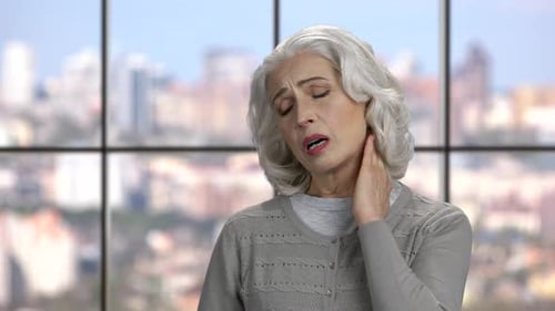 Close Up Mature Woman Suffering From Neck Pain