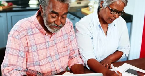 Mature Couple Managing Finances at Home Together