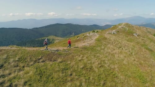 Hikers On Hill Slope, Walking on Rocky Path