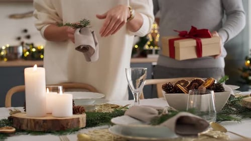 Couple Decorates Holiday Table and Exchange Gift