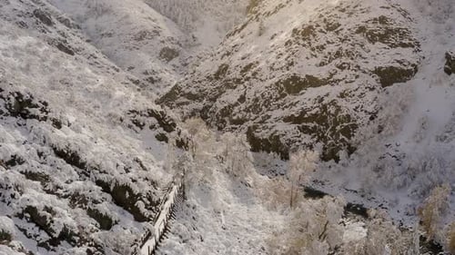 Snowy Mountains and River Gorge Aerial View