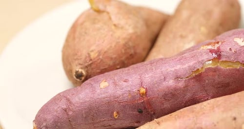 Close Up of Fresh Sweet Potatoes on Plate