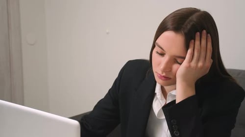 Close Up Tired Sad Businesswoman Face Looking at Laptop at the Home Office