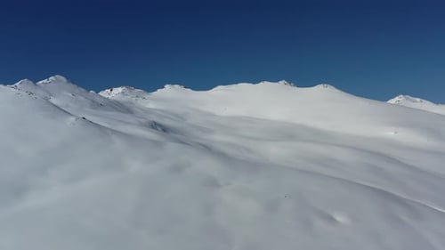 Snow covered mountains and blue sky