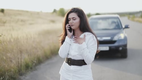 Worried About Broken Car Out of City Girl Talking on the Phone