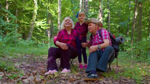 Grandparents and Child Enjoying Time in Forest
