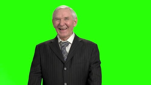 Senior Man Laughing and Celebrating on Green Screen
