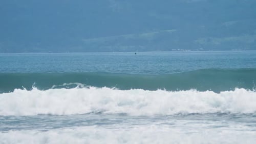Breaking Waves in the Blue Sea with Huge Splash in Slow Motion Shot