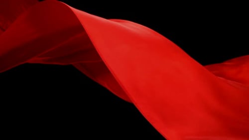 Flowing Red Fabric on Black Background