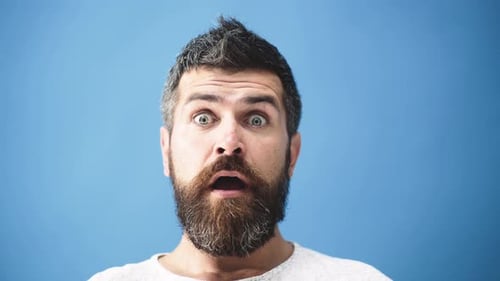 Man With Beard Looks Surprised With Mouth Open