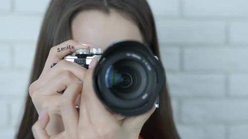 Photographer with a camera close-up.