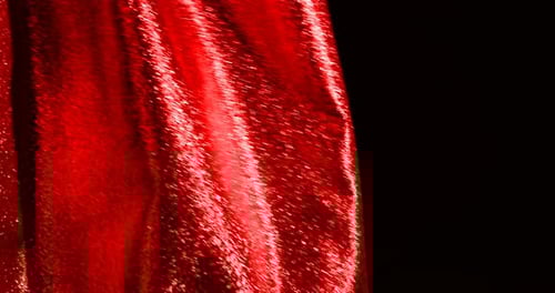 Flowing Red Fabric on Black Background