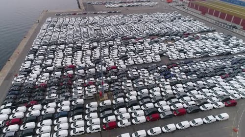 Thousands of New Cars Parked in an Urban Port