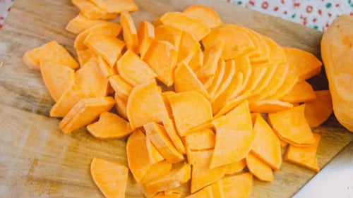 Sliced Sweet Potatoes on Wooden Cutting Board