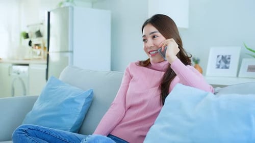 Smiling Woman Chatting on Phone in Modern Home