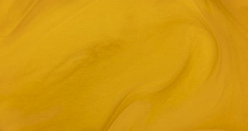Abstract Swirling Golden Fluid Texture Background