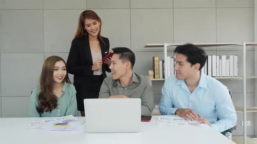 Four colleagues working together at the office