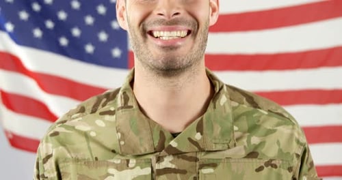 Smiling Man in Camouflage with American Flag