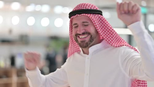 Bearded Man Dances in Celebration