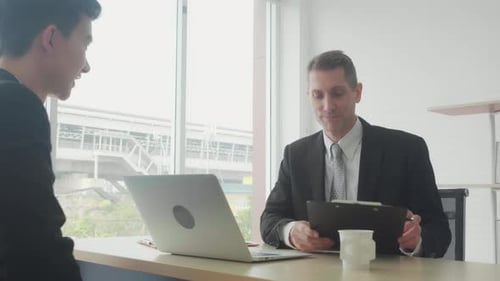 Young asian businessman job interview with manager and successful at the office.