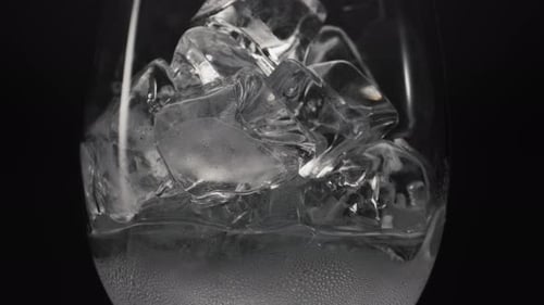Close-up of Ice Cubes Melting in a Glass