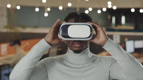 Office Male Worker Wearing a VR Headset Virtual Reality Concept