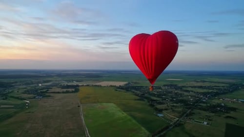 Heart Shaped Balloon Floats Over Beautiful Landscape