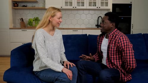 Man Presents Gift to a Delighted Woman